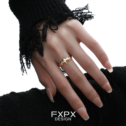 Elegant FXPX princess knight couple rings in gold with intricate design on a hand model