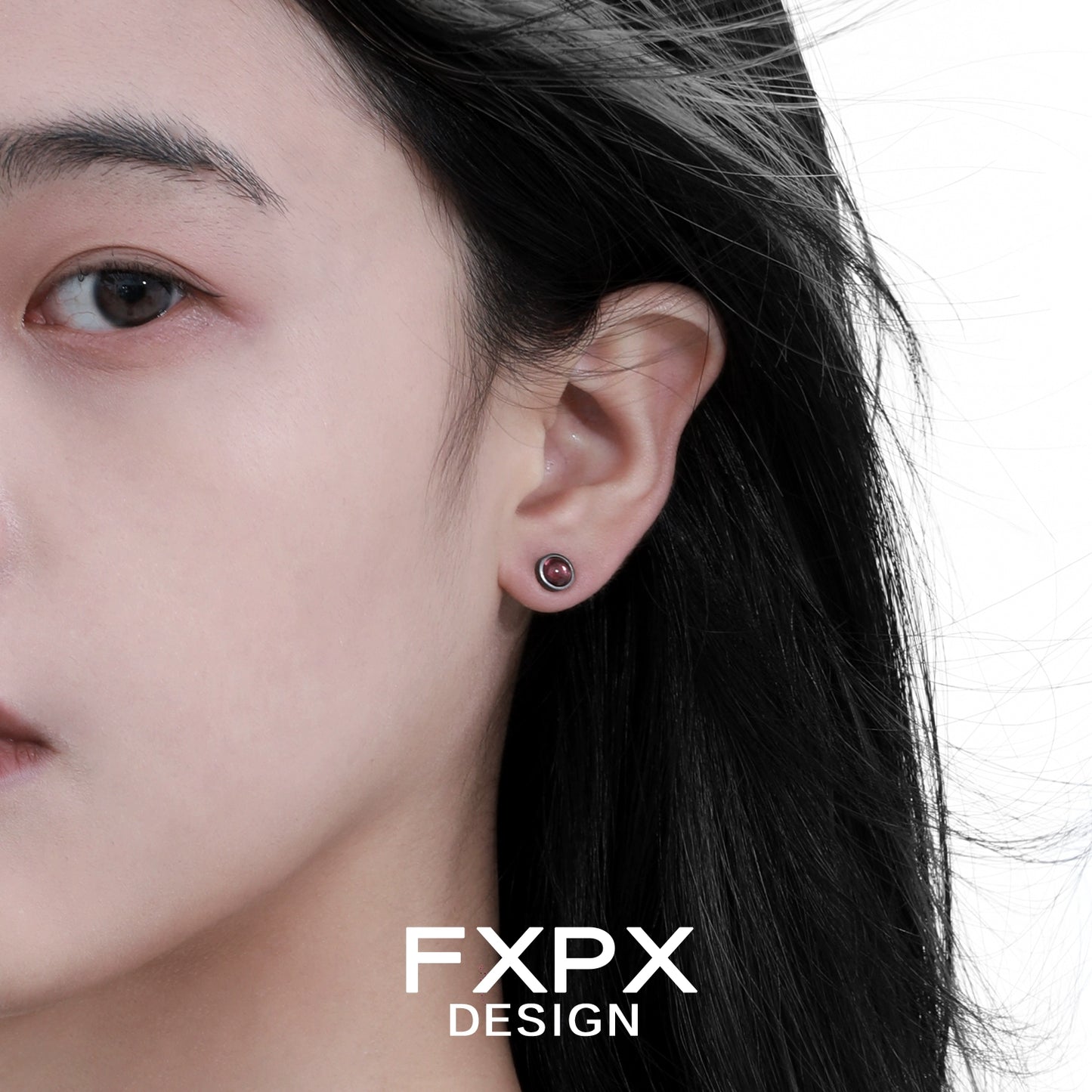 Punk crystal stud earrings showcased on model with dark hair for a trendy look