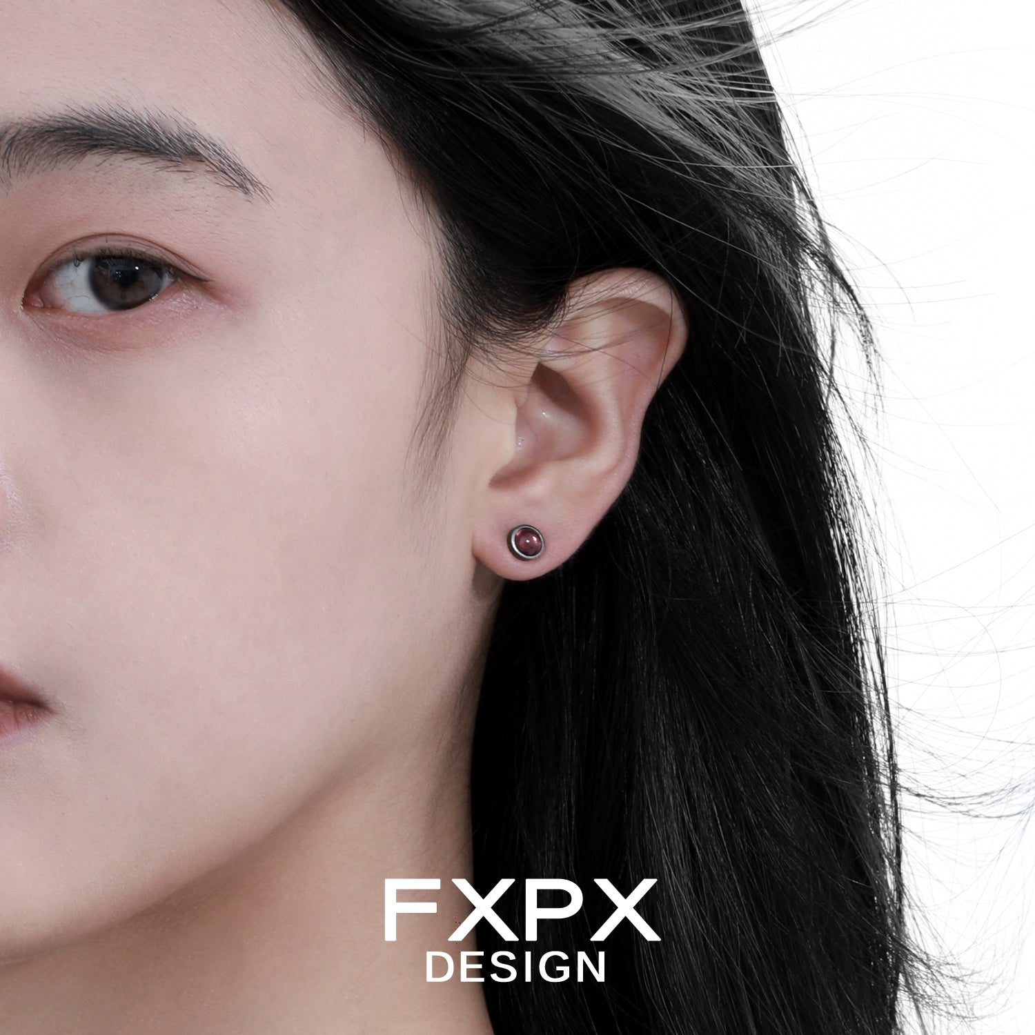 Punk crystal stud earrings showcased on model with dark hair for a trendy look