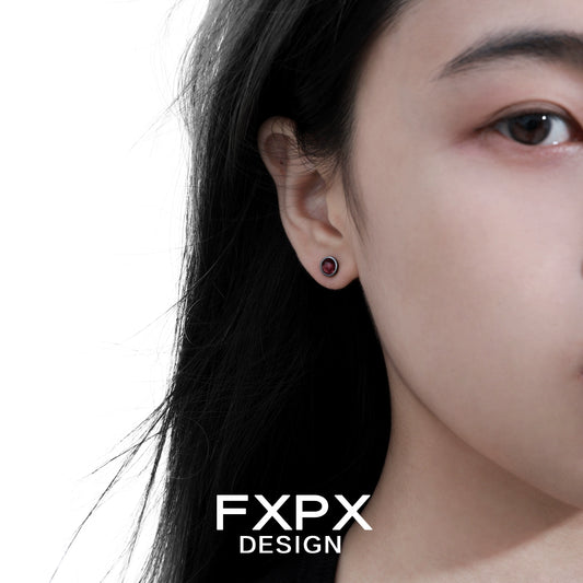 Elegant FXPX punk crystal stud earrings displayed on a model's ear for a trendy look