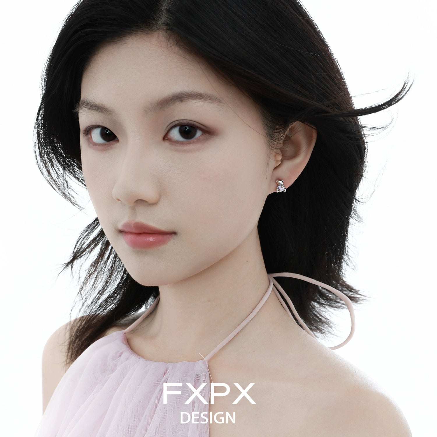 Model wearing FXPX purple bear stud earrings, showcasing a playful and stylish design
