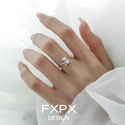 Stylish FXPX purple zircon bear ring on a model's hand featuring a unique design