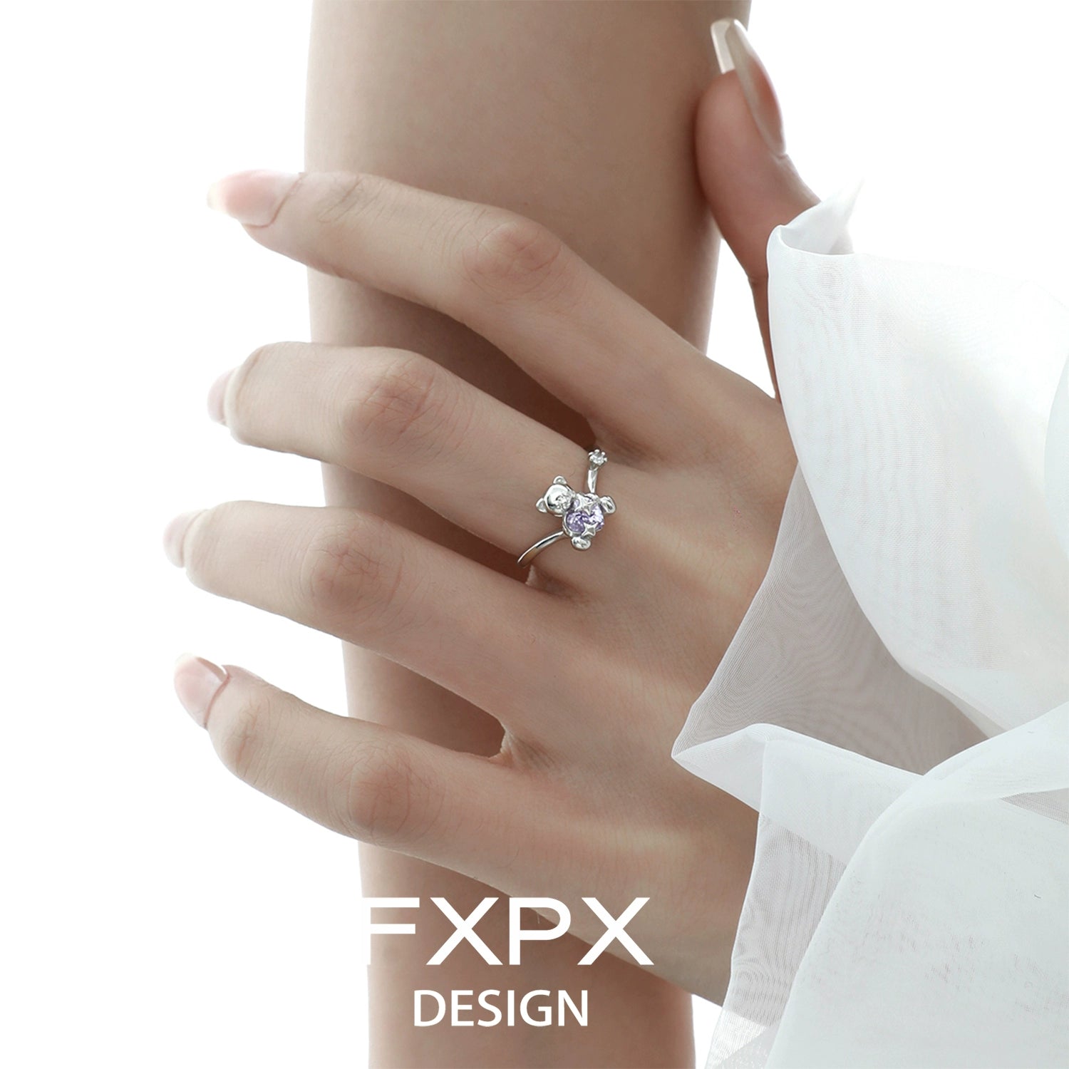 Elegant FXPX purple zircon bear ring on a model's hand showcasing its charming design