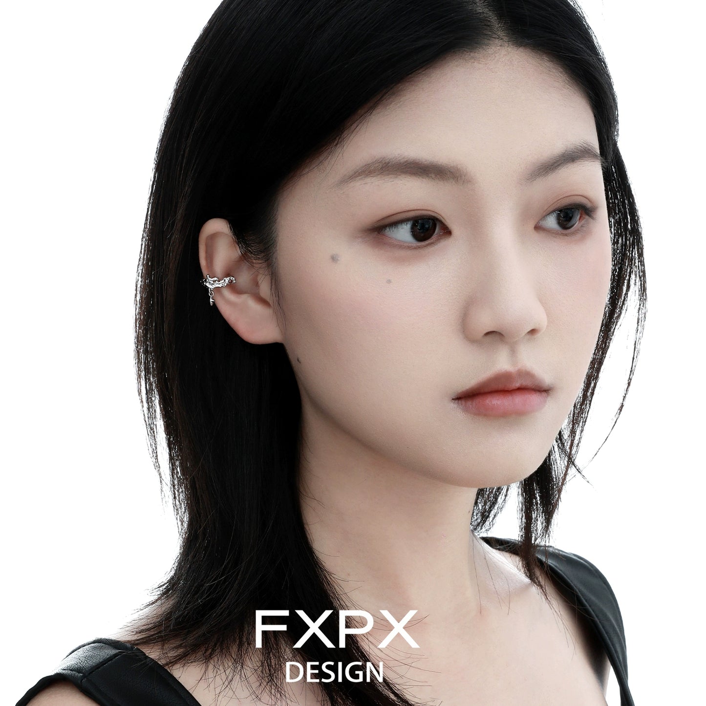 Elegant model wearing FXPX red zircon ear clips that enhance any outfit with stylish flair
