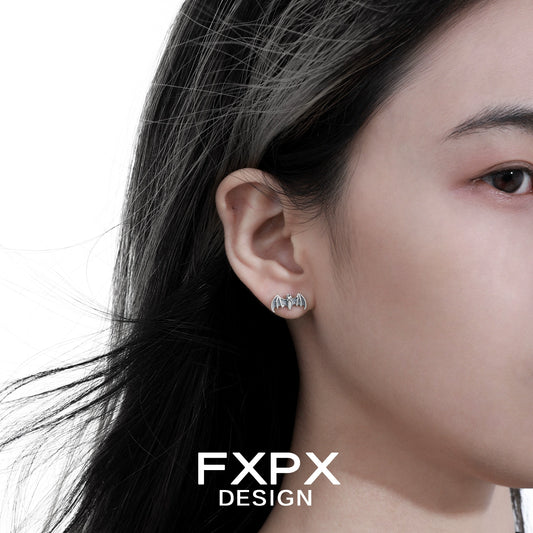 Stylish retro bat stud earrings in silver design, perfect for unique fashion statements