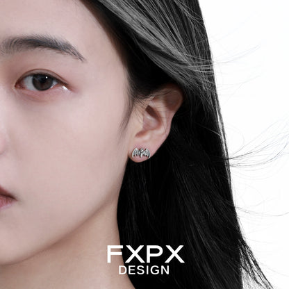 FXPX retro bat stud earrings worn by a model with flowing hair for a stylish look