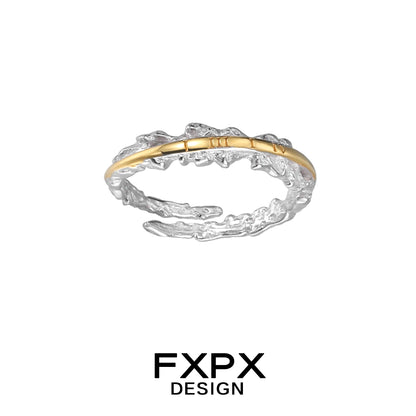 Elegant FXPX roman numeral couple rings featuring a unique twisted design with gold and silver tones.