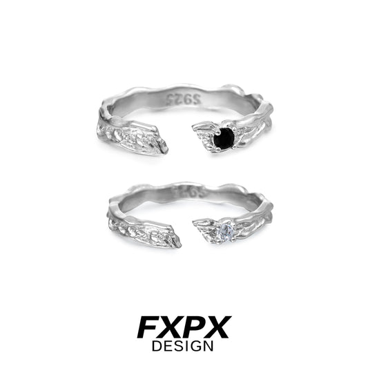 FXPX secret bond couple rings in silver, featuring an elegant design with black and white stones