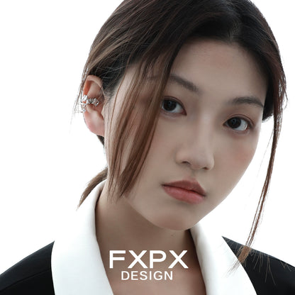 Model wearing FXPX shattered prism zircon ear cuff, showcasing a modern and elegant design