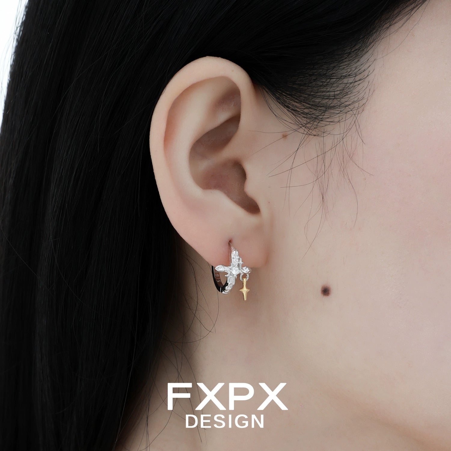 Stylish FXPX silver axis cross earrings displayed on a model's ear, perfect for any occasion