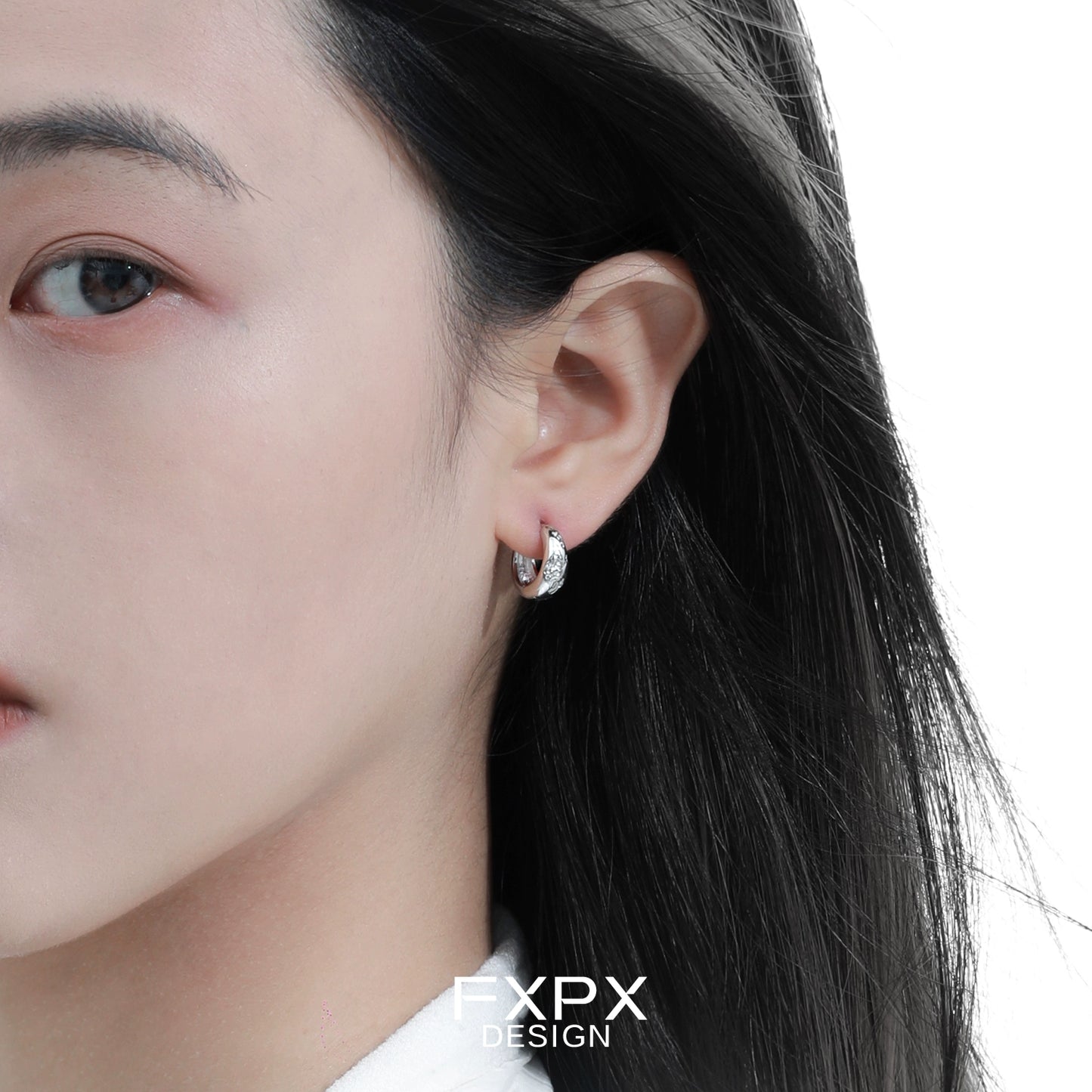 Elegant silver ear clips for women with a modern design, perfect for everyday wear