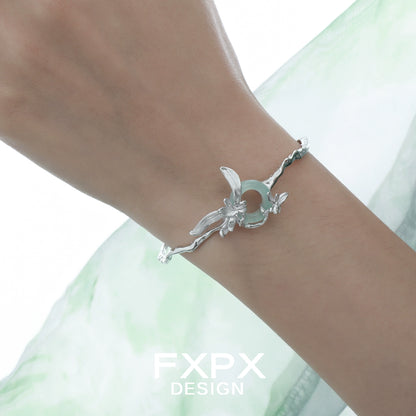 Delicate silver iris flower bracelet from FXPX showcasing intricate floral design on a wrist