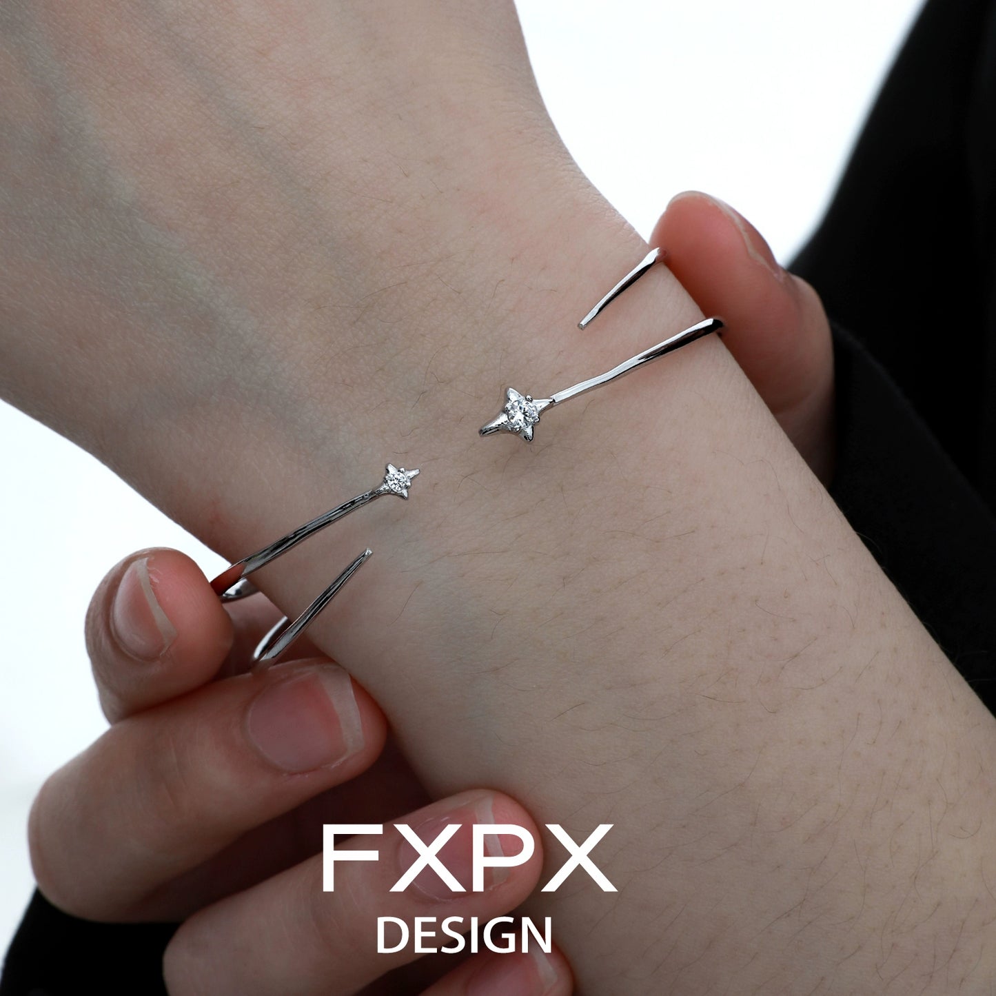 Minimalist FXPX silver star bracelet with sparkling star detail for a chic accessory look