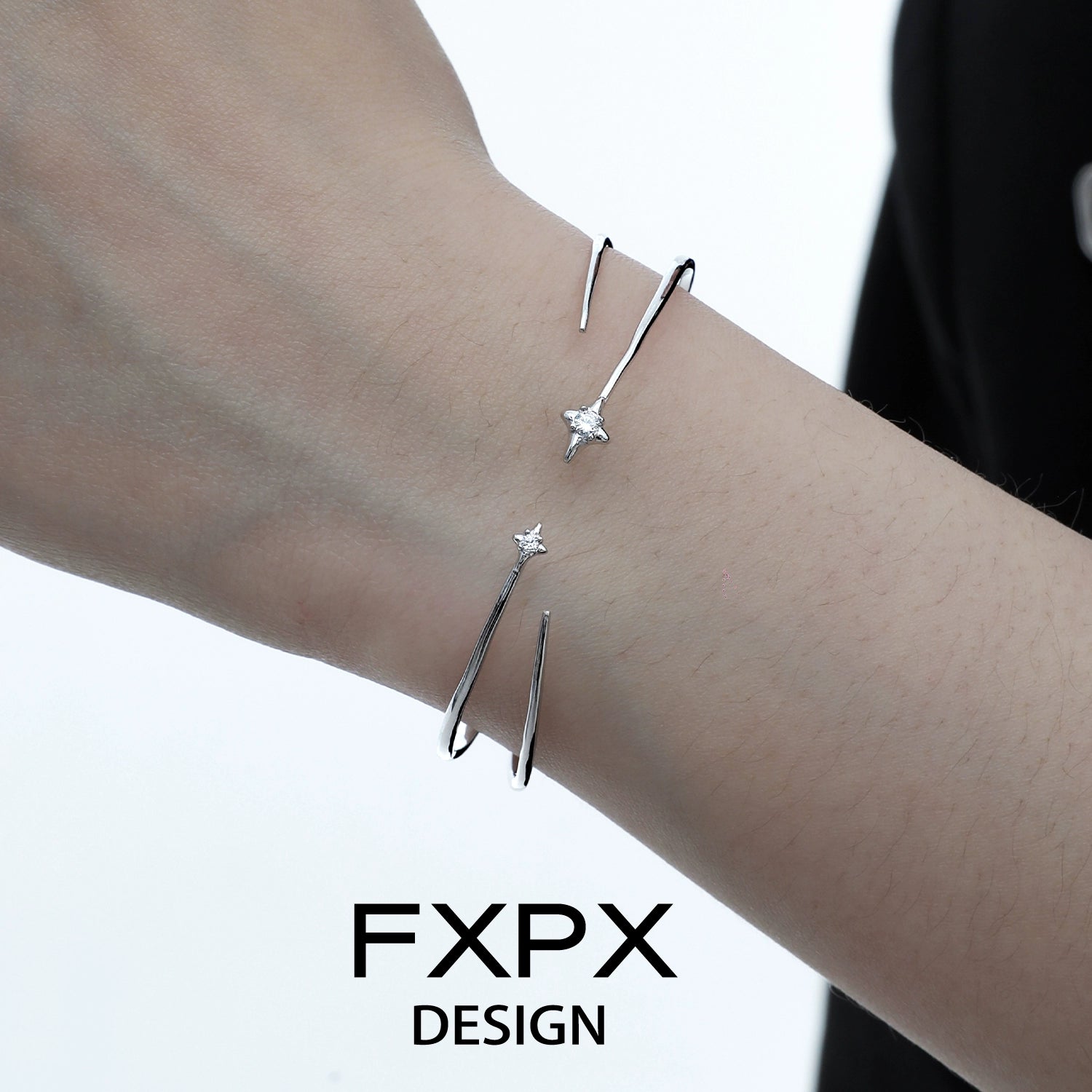 Stylish FXPX silver star bracelet elegantly worn on a wrist for trendy accessory lovers
