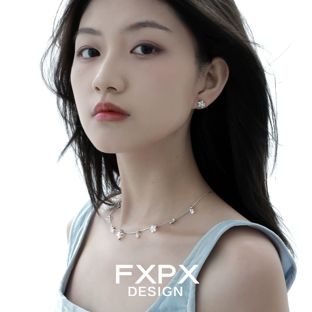 Elegant silver star necklace by FXPX featuring delicate star pendants for a stylish look