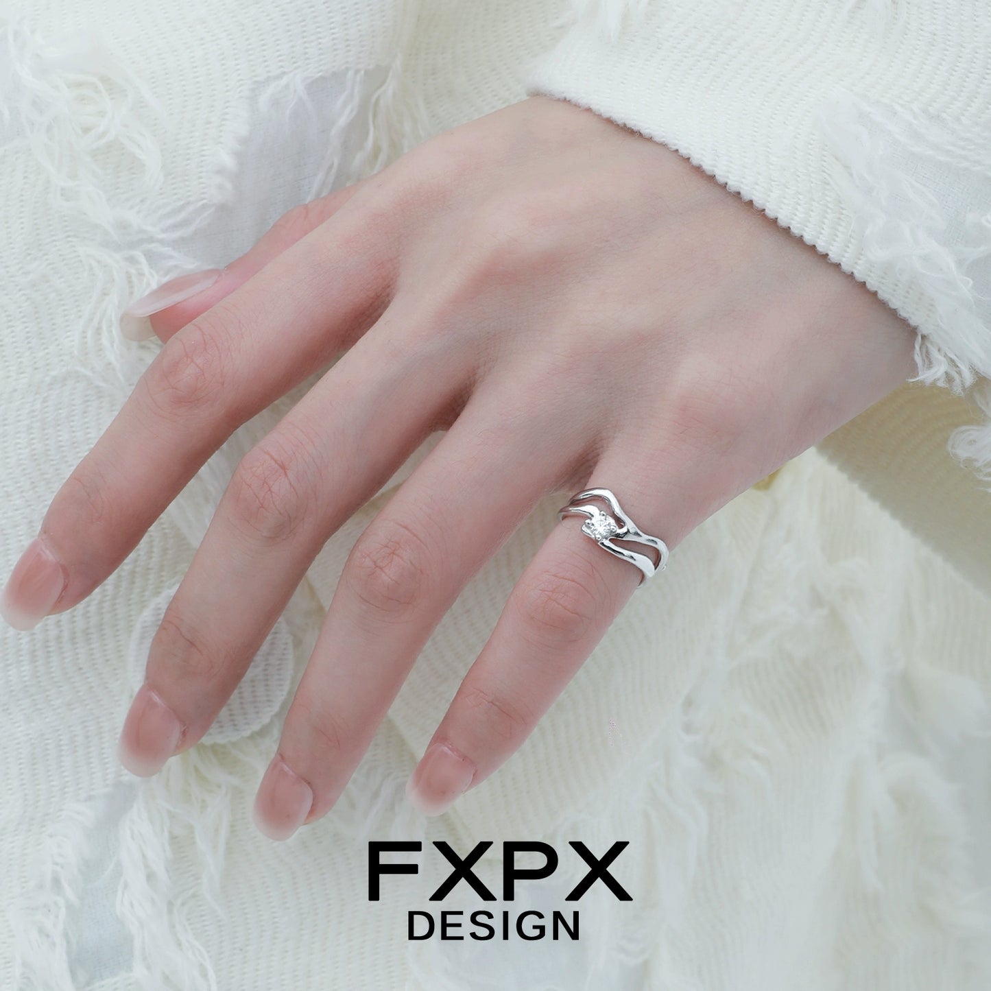Stylish silver wave zircon ring showcased on a model's hand, perfect for elegant occasions