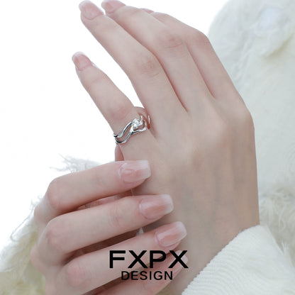 FXPX Silver Wave Zircon Ring shown on a model's hand with elegant, long nails