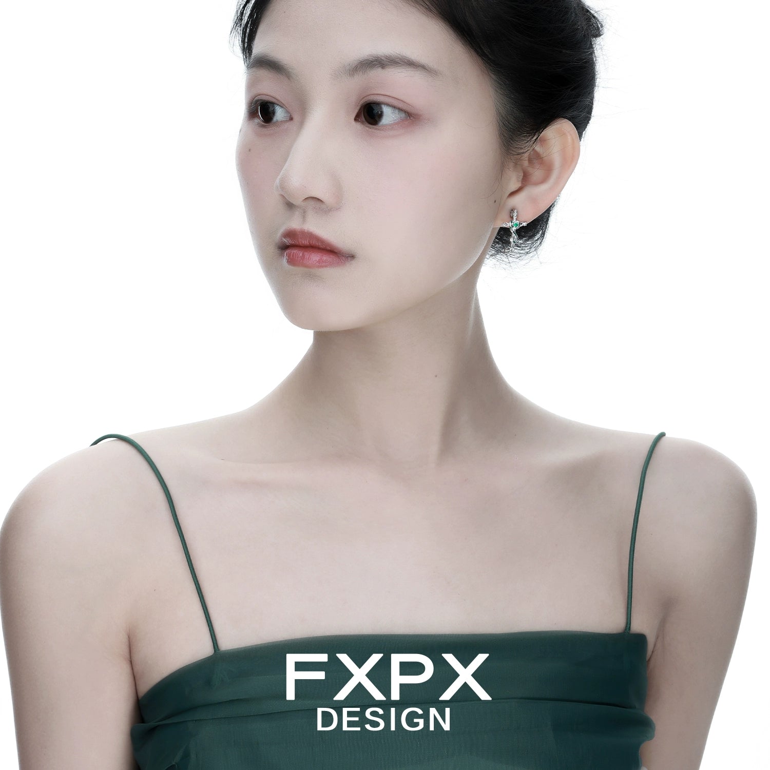 Elegant FXPX snake cross earrings worn by a model showcasing modern jewelry design