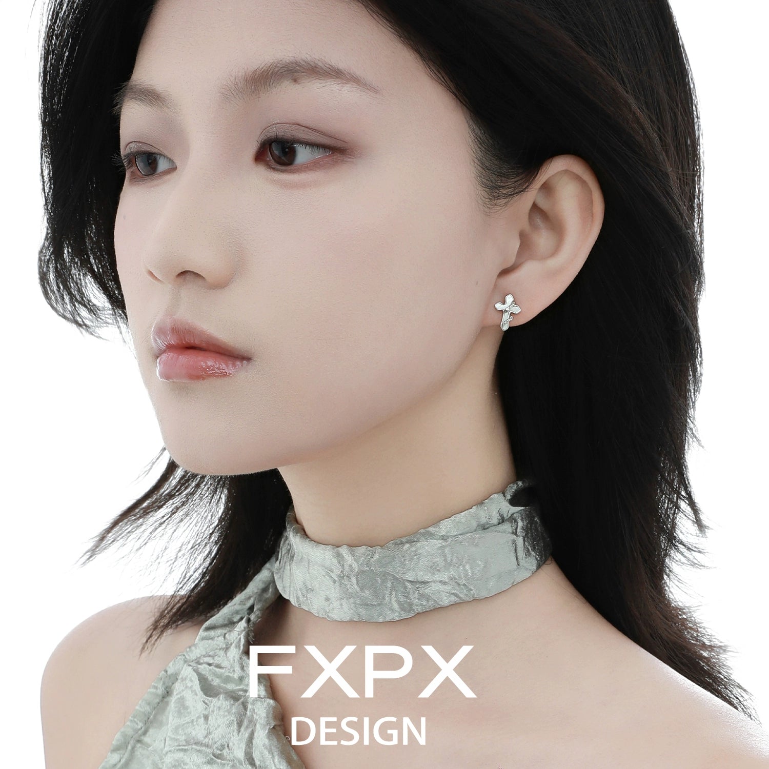 FXPX snake wrap cross earrings displayed on a model showcasing elegant design and style