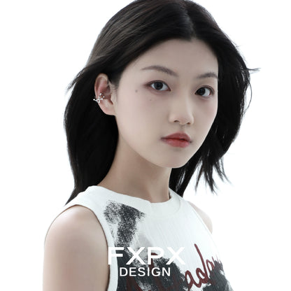Stylish model wearing a special shaped silver ear cuff for a trendy look
