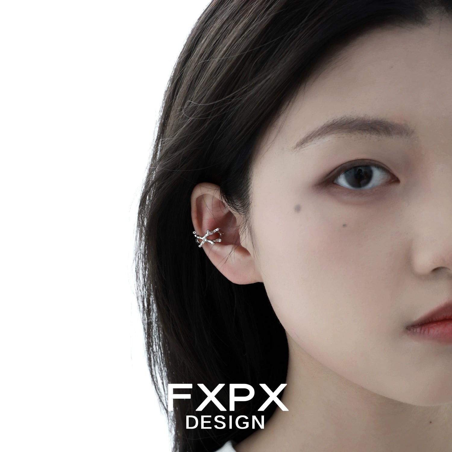 Model wearing special shaped silver ear cuff, showcasing its unique design and elegant look