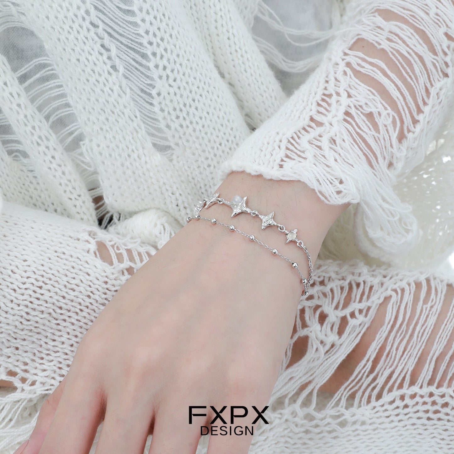 Elegant FXPX star silver bracelet featuring delicate star and bead accents for a stylish look
