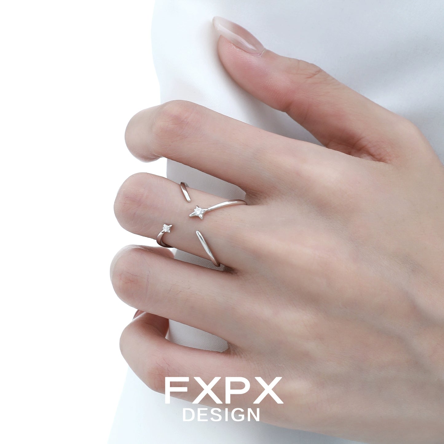 Stylish FXPX star silver ring on a hand featuring a unique minimalist design