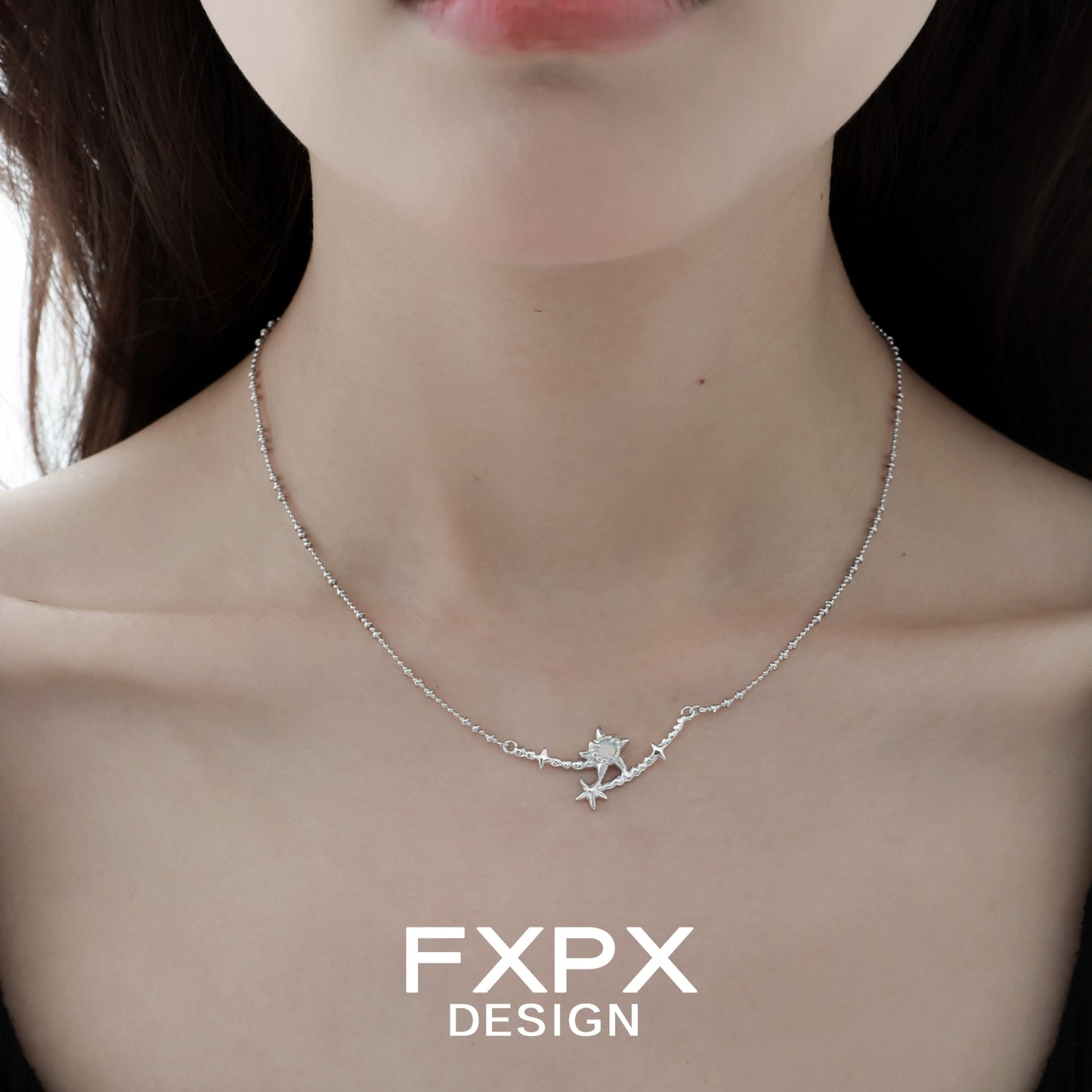 FXPX starfish necklace in silver featuring a delicate design perfect for ocean lovers