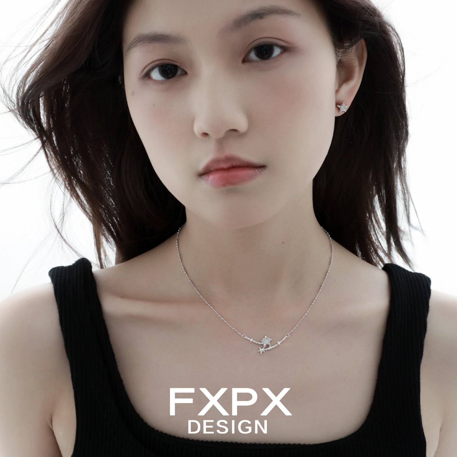 Elegant FXPX starfish necklace on a model, showcasing a delicate design and ocean-inspired style