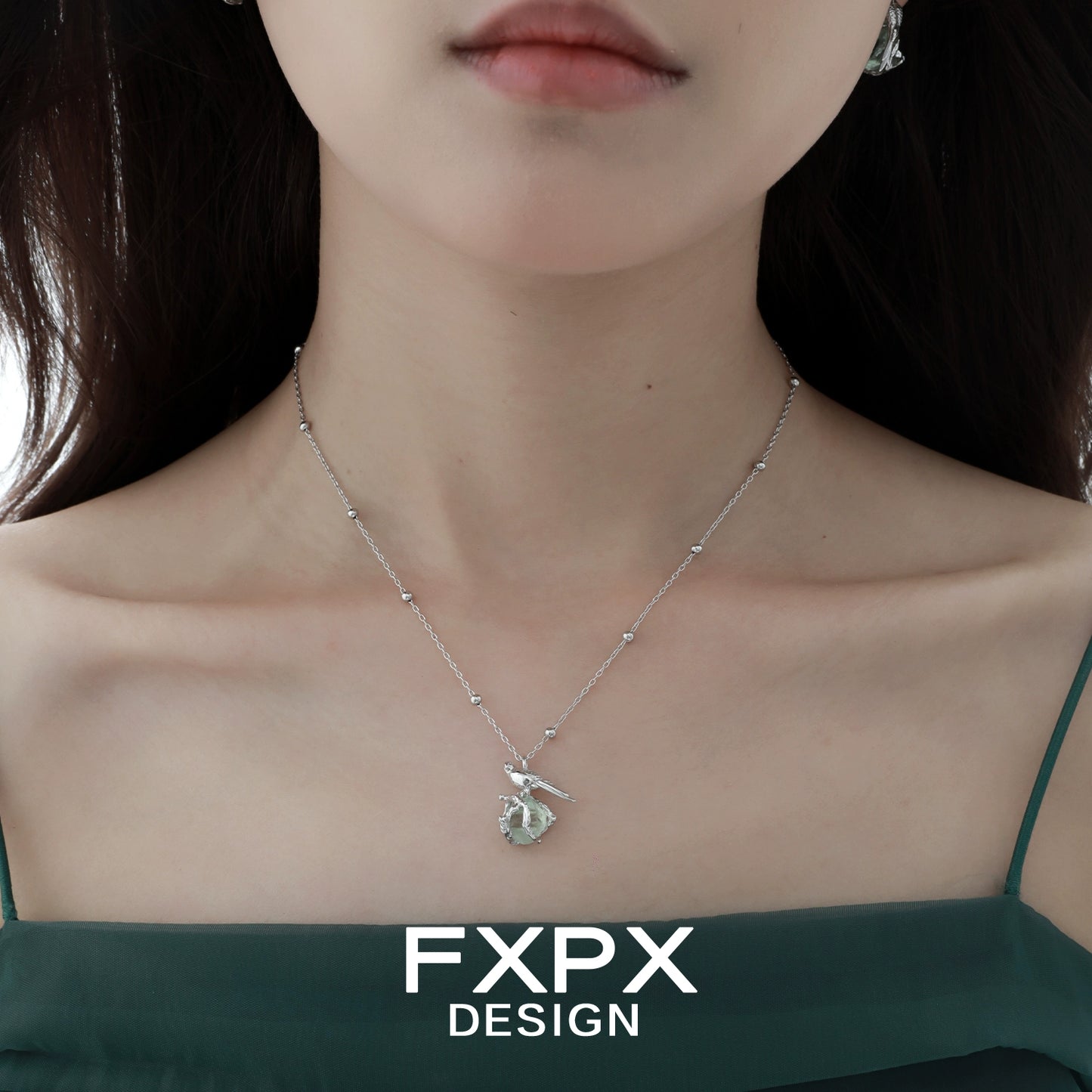 Swallow fluorite silver necklace showcased elegantly on a model's neckline
