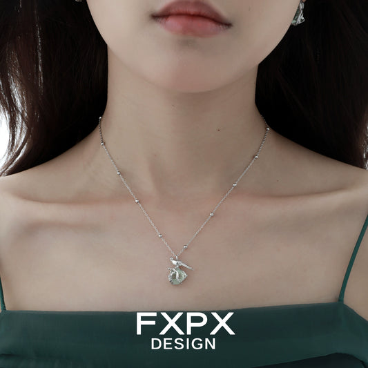 Swallow fluorite silver necklace showcased elegantly on a model's neckline