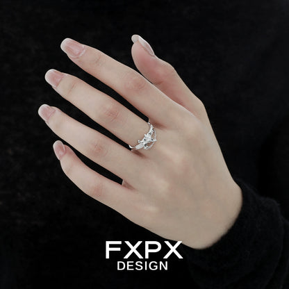 FXPX sword cross ring displayed on a model's hand, featuring intricate design and silver finish