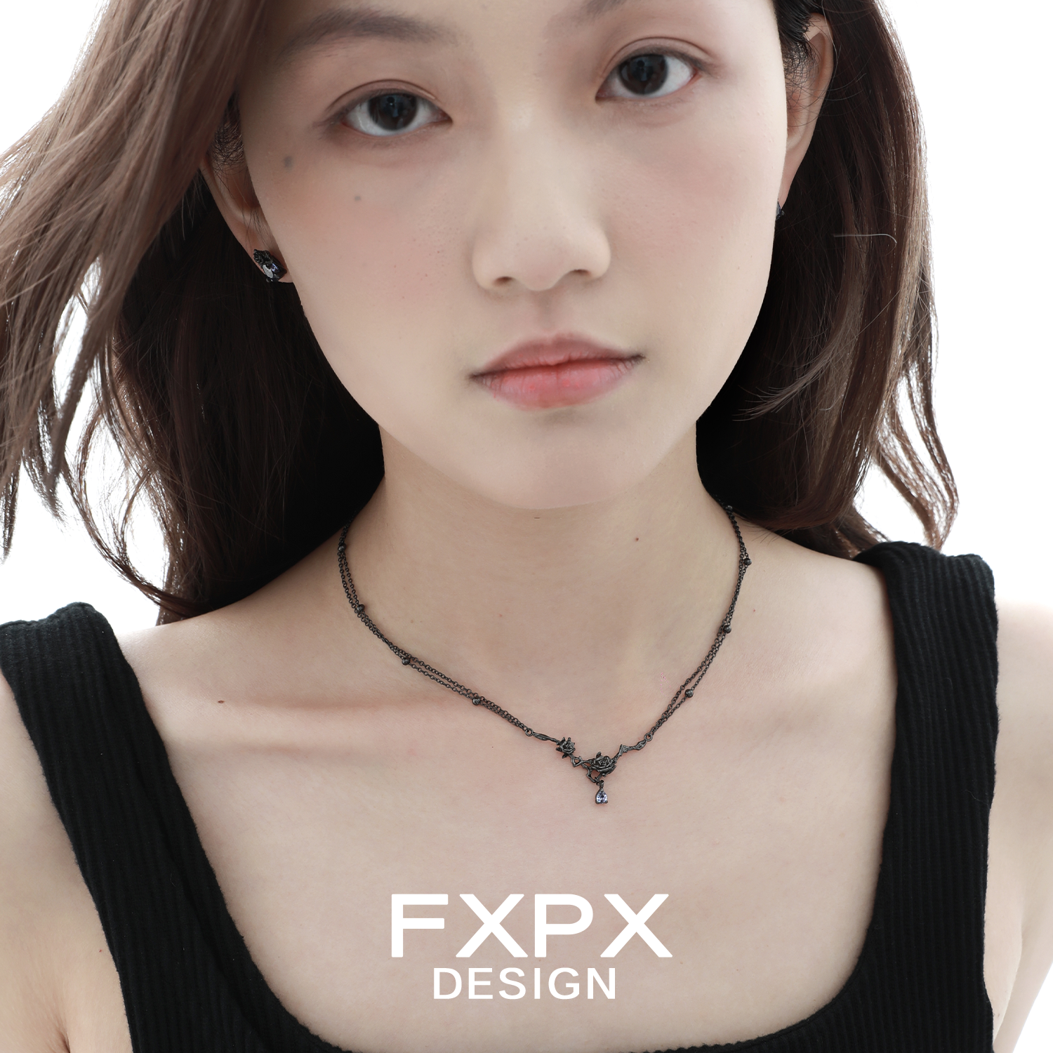 Elegant FXPX Tanzanian blue black rose necklace on a model showcasing its unique design