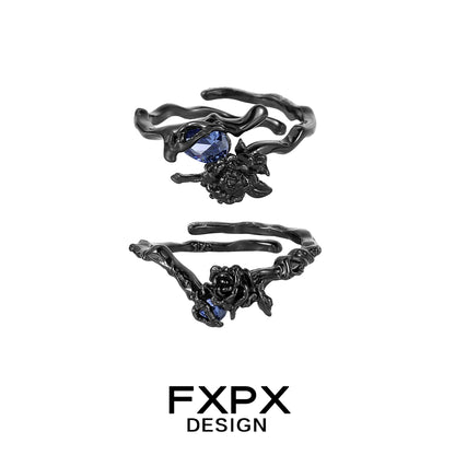 FXPX Tanzanian blue rose ring with a unique twisted design and blue gemstone accents