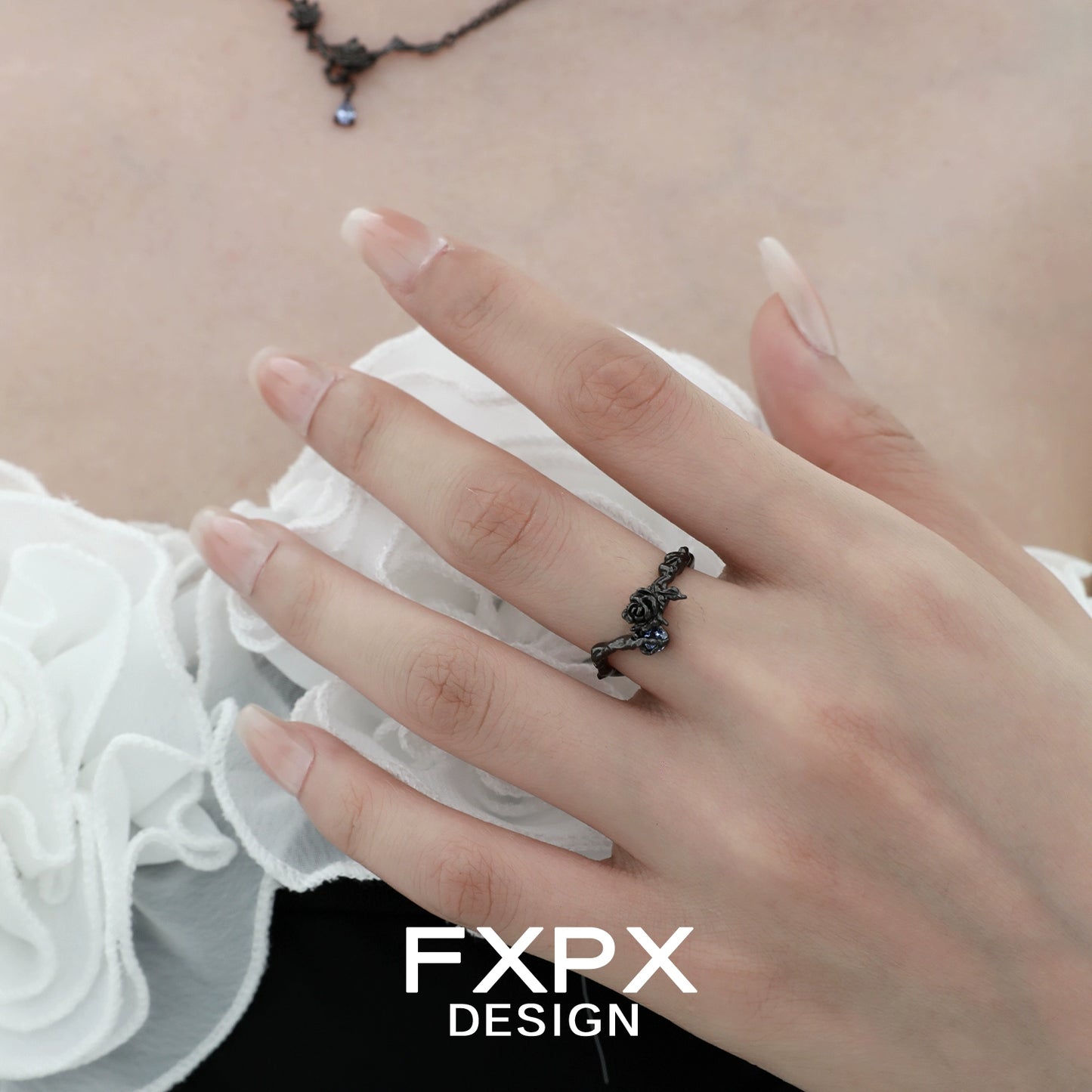 Elegant FXPX Tanzanian blue rose ring showcased on a model's hand, highlighting its intricate design