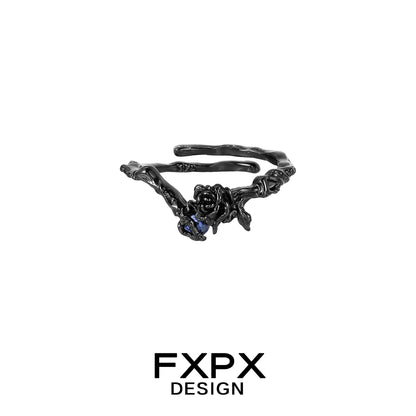 FXPX Tanzanian blue rose ring featuring a unique twisted band design and detailed rose motif