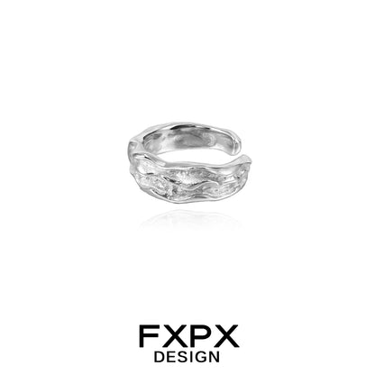 Textured silver ear cuff by FXPX with a unique wave design for stylish ear accessories