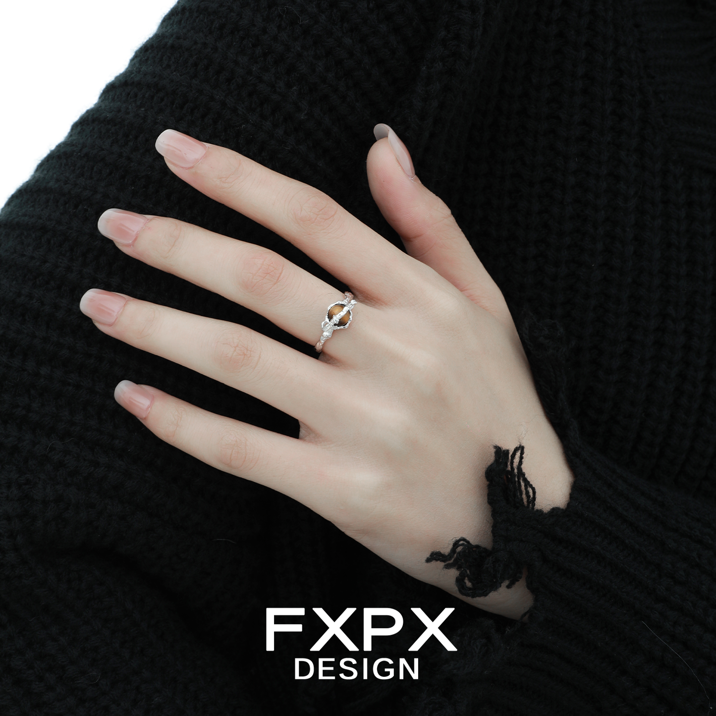 Elegant FXPX tiger eye ring for women displayed on a hand with a black sweater