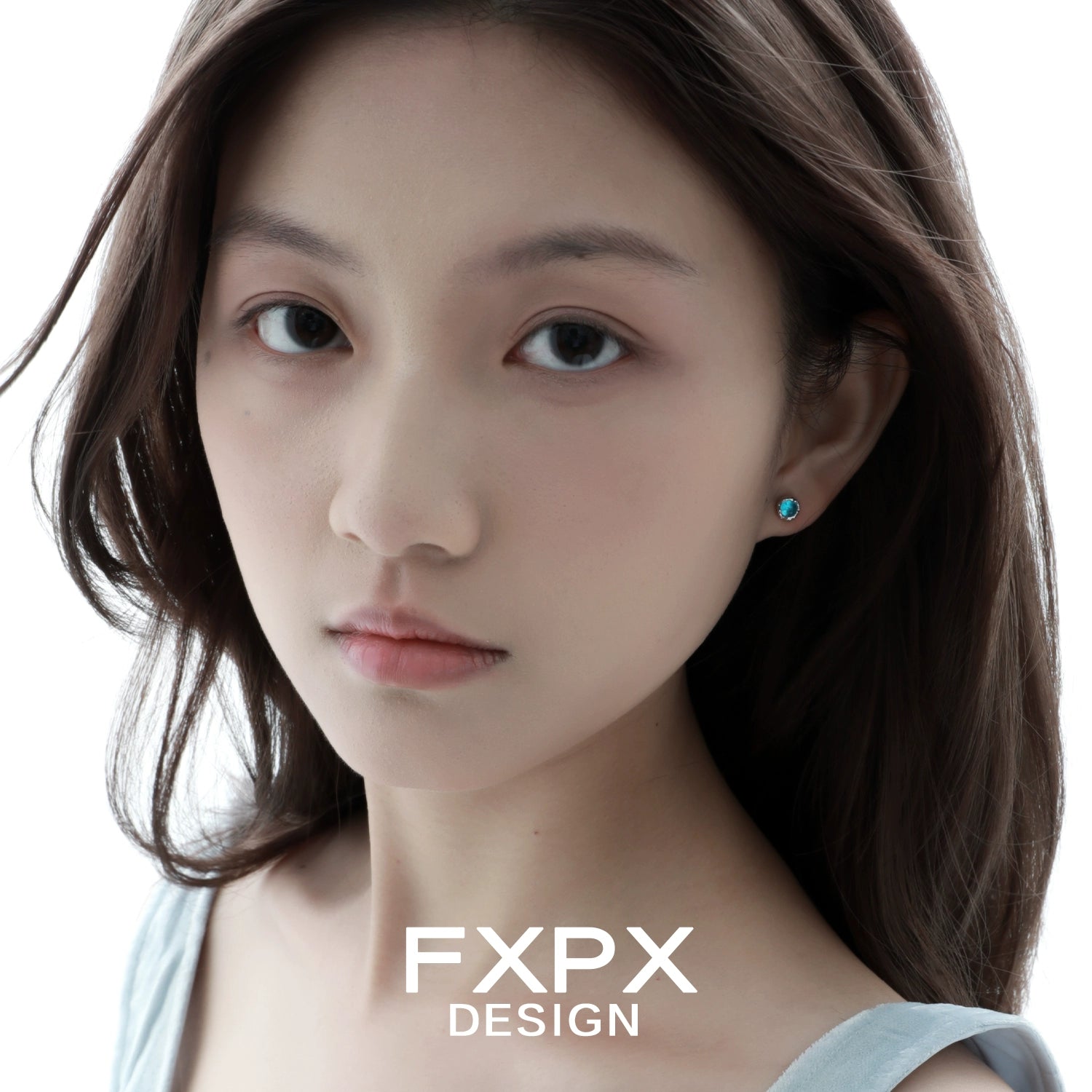 Model wearing turquoise blue screw stud earrings showcasing elegant design and vibrant color