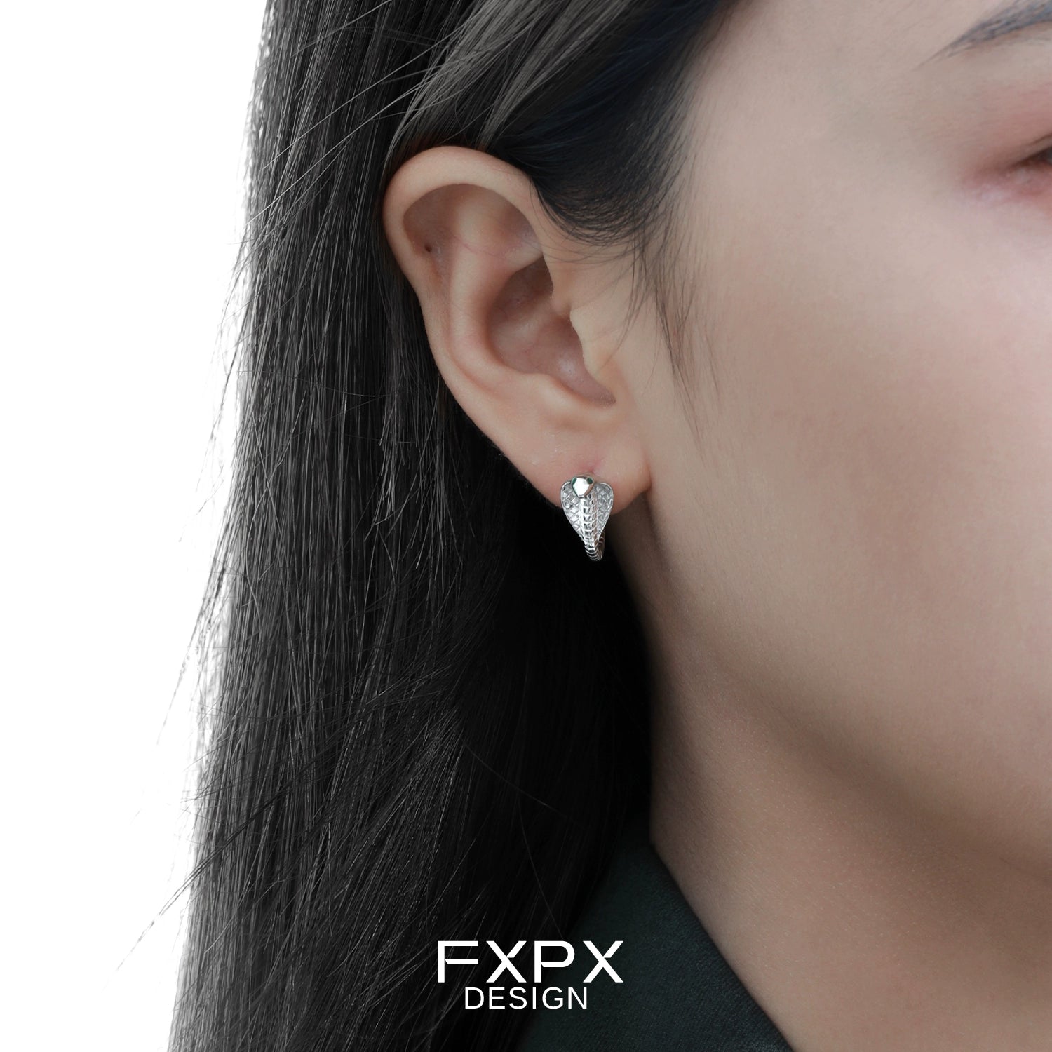 FXPX unique serpent earrings for women showcasing a stylish design on model's ear