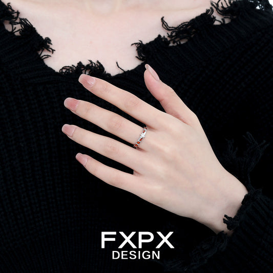 Elegant vintage checkerboard star ring showcased on a hand with a black textured background