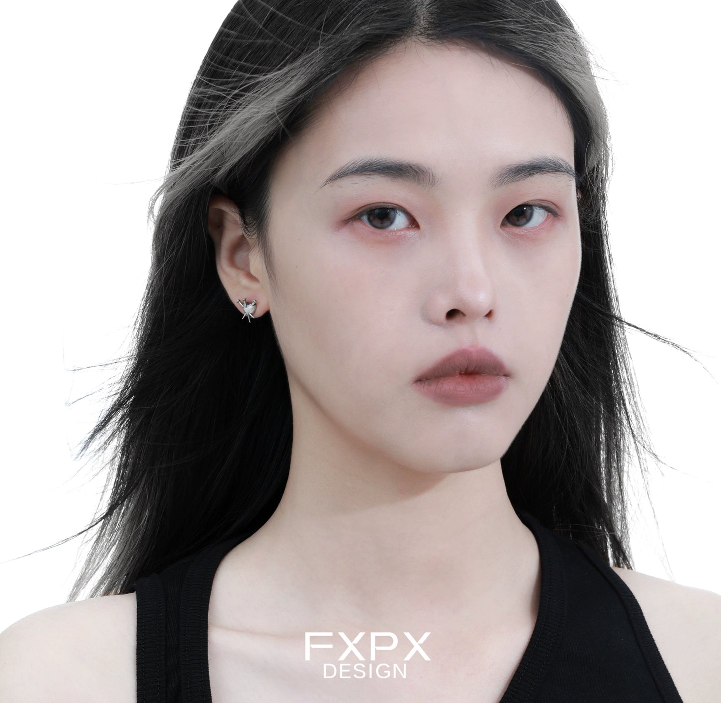 Stylish vintage punk silver earrings showcased on a model with long black hair