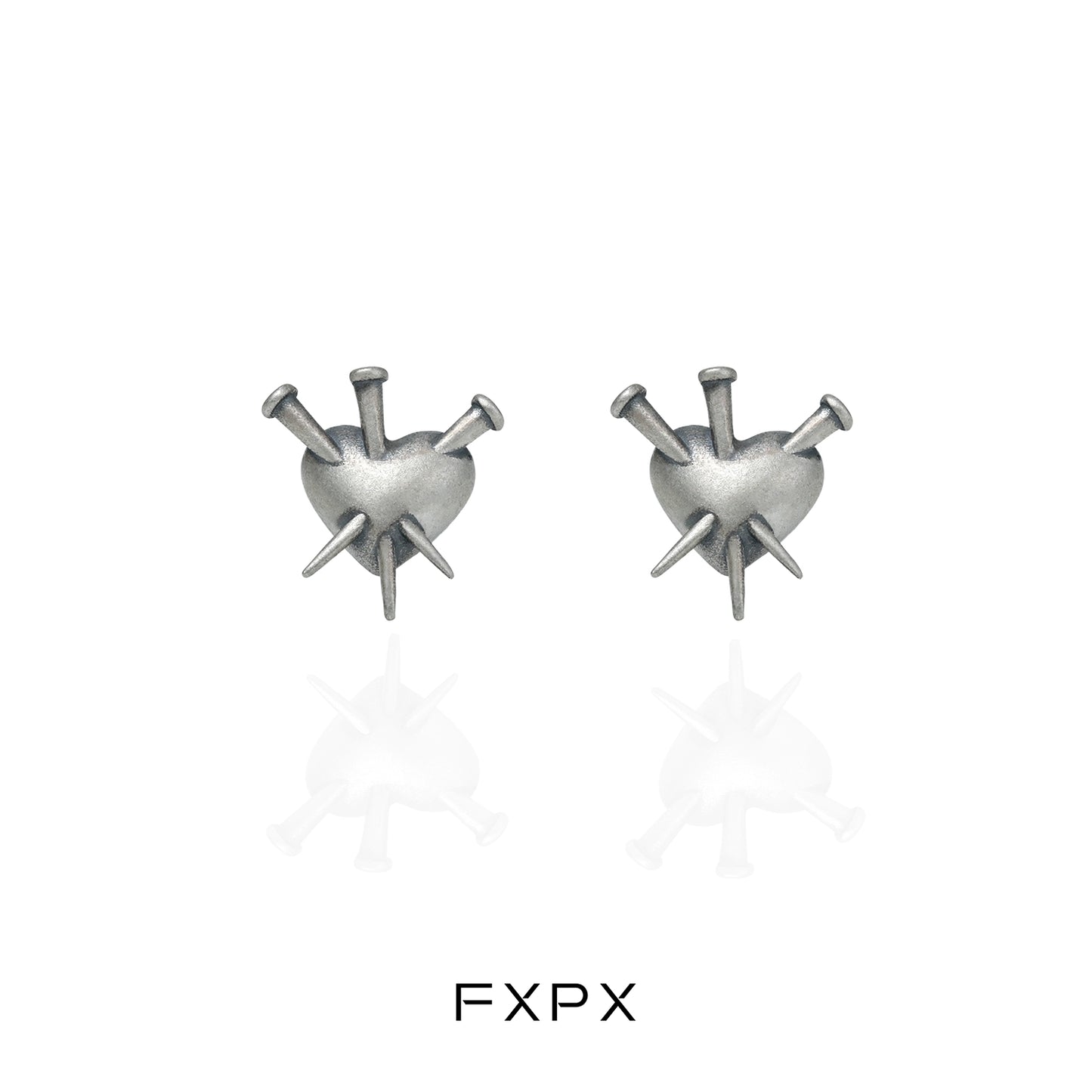 Vintage punk silver earrings featuring a heart design with spikes for a bold fashion statement