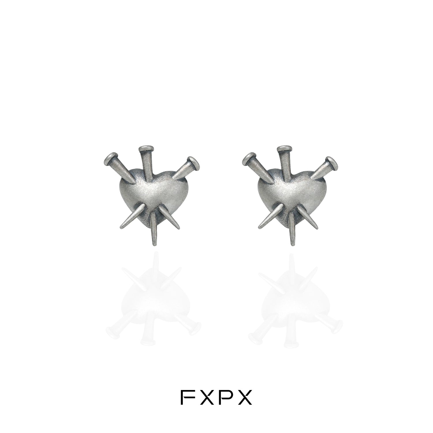 Vintage punk silver earrings featuring a heart design with spikes for a bold fashion statement