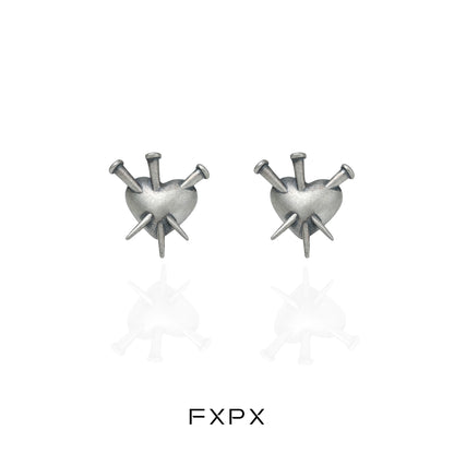Vintage punk silver earrings featuring a heart design with spikes for a bold fashion statement