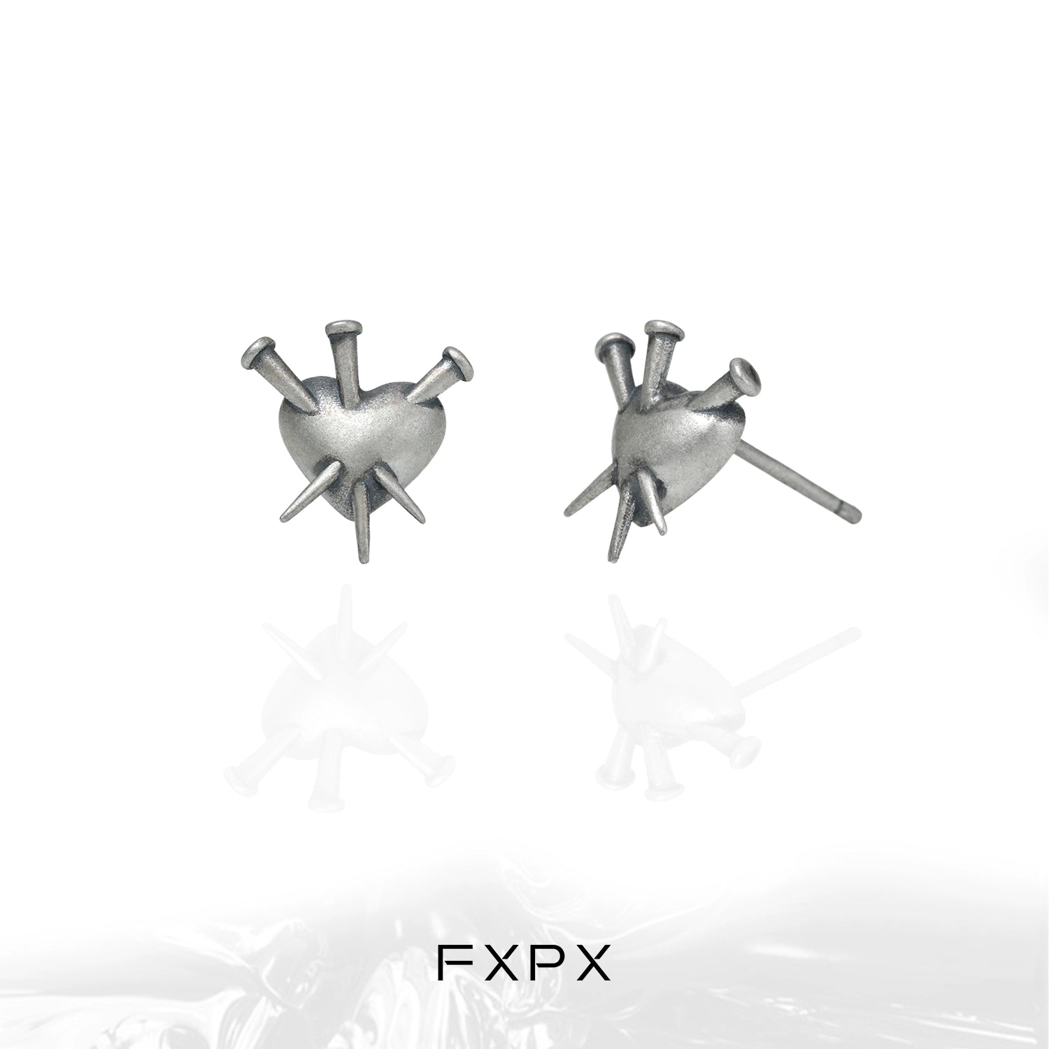 FXPX vintage punk silver earrings featuring a heart design with spikes for a bold look