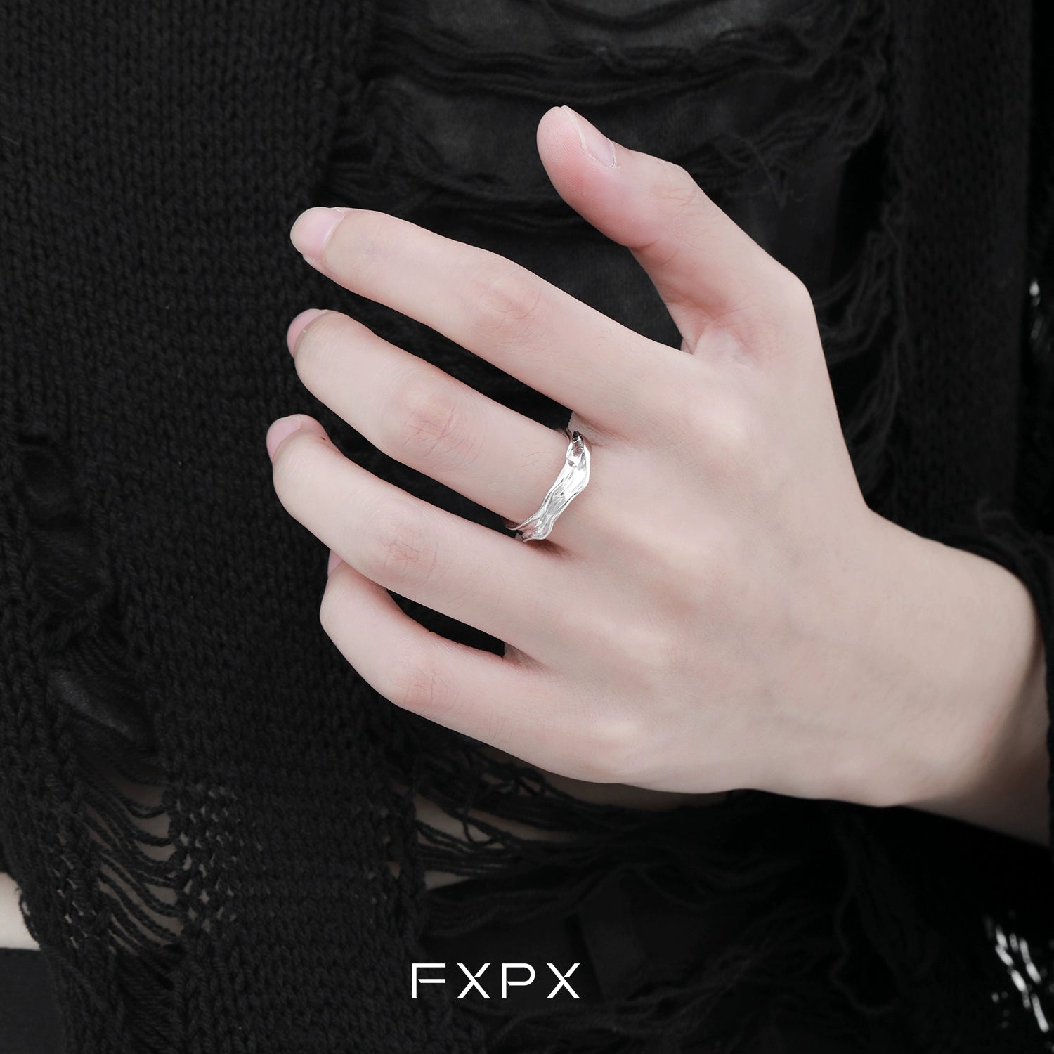 Stylish FXPX voyage texture ring displayed on a hand with intricate design