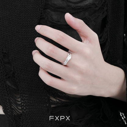 Stylish FXPX voyage texture ring displayed on a hand with intricate design