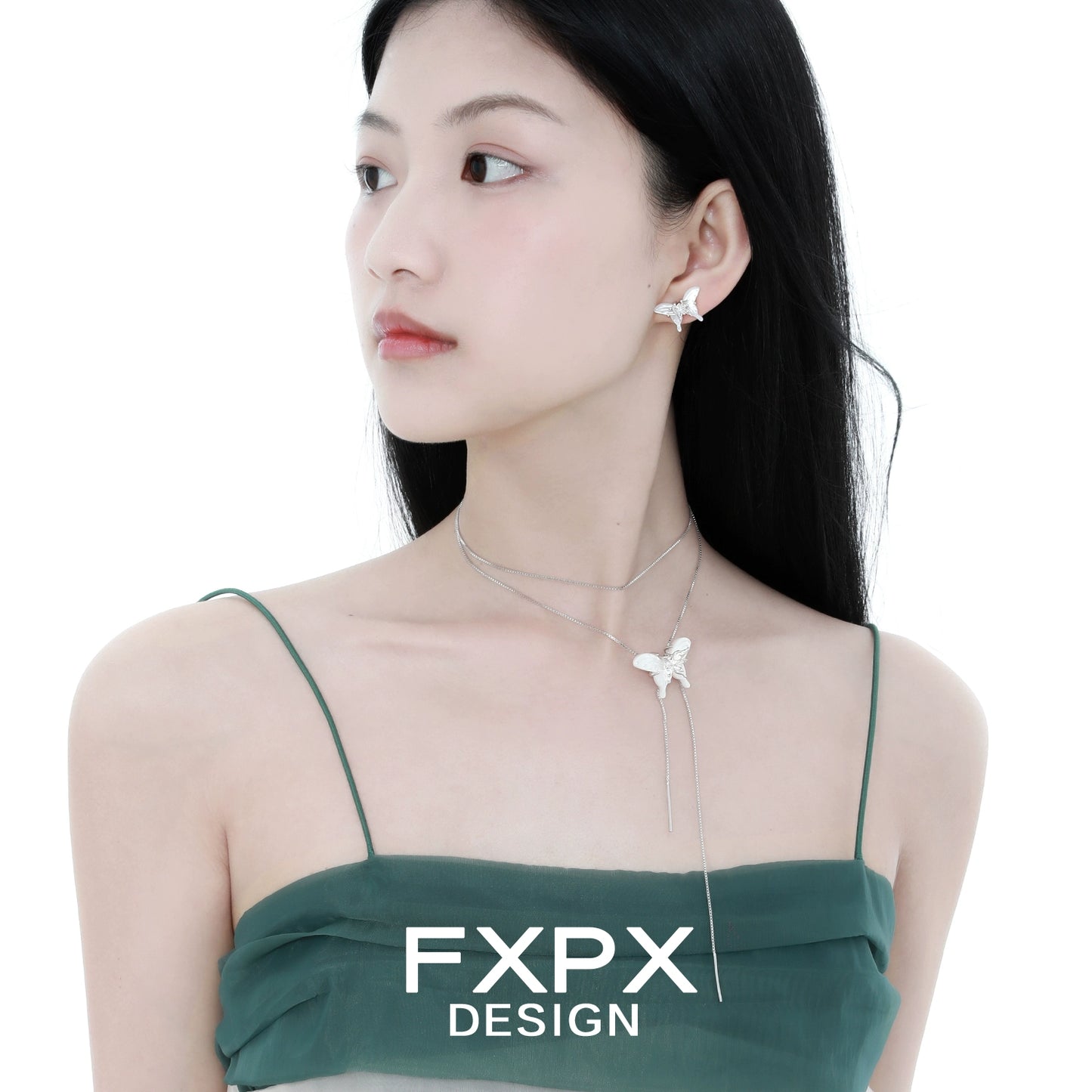 Elegant white shell butterfly earrings by FXPX worn by a model with a stylish outfit