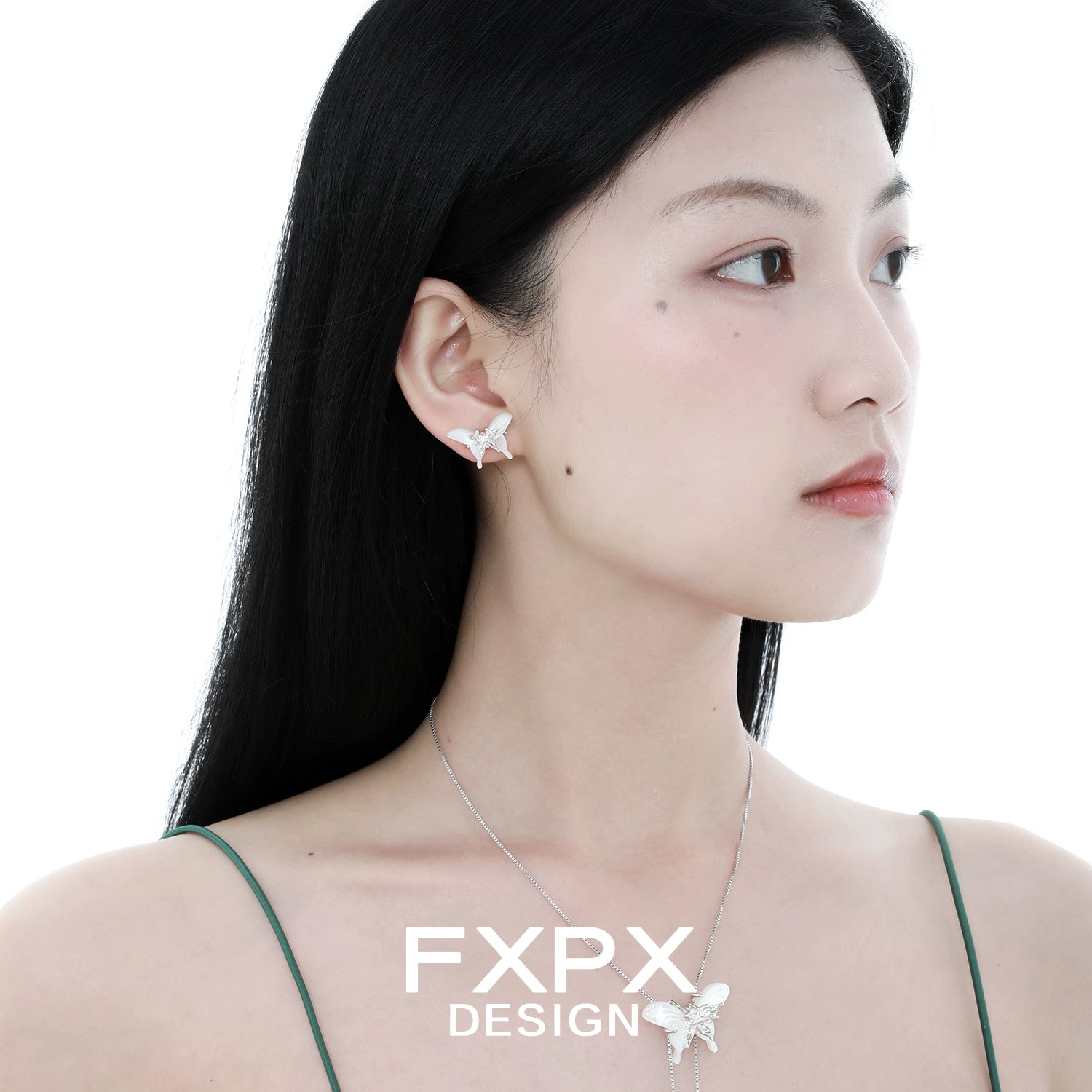 Model wearing elegant white shell butterfly earrings for a stylish and delicate look